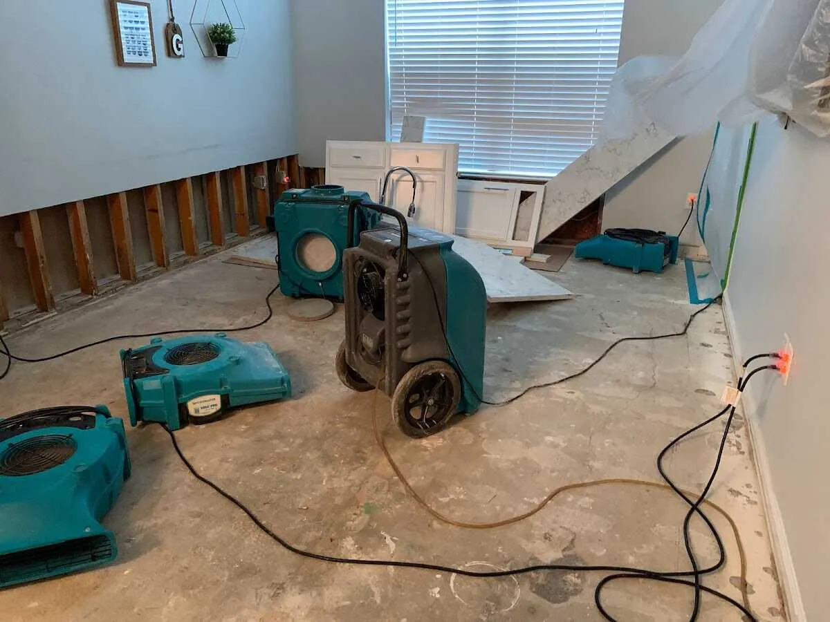 Dehumidifier in flood-cut room for Water Damage Restoration in Troy